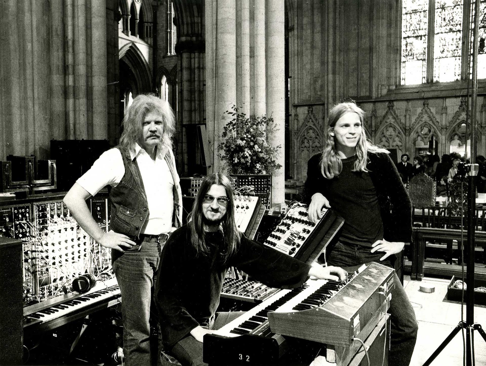 Edgar Froese, Christopher Franke and Peter Baumann among synthesizers and Mellotrons in a cathedral